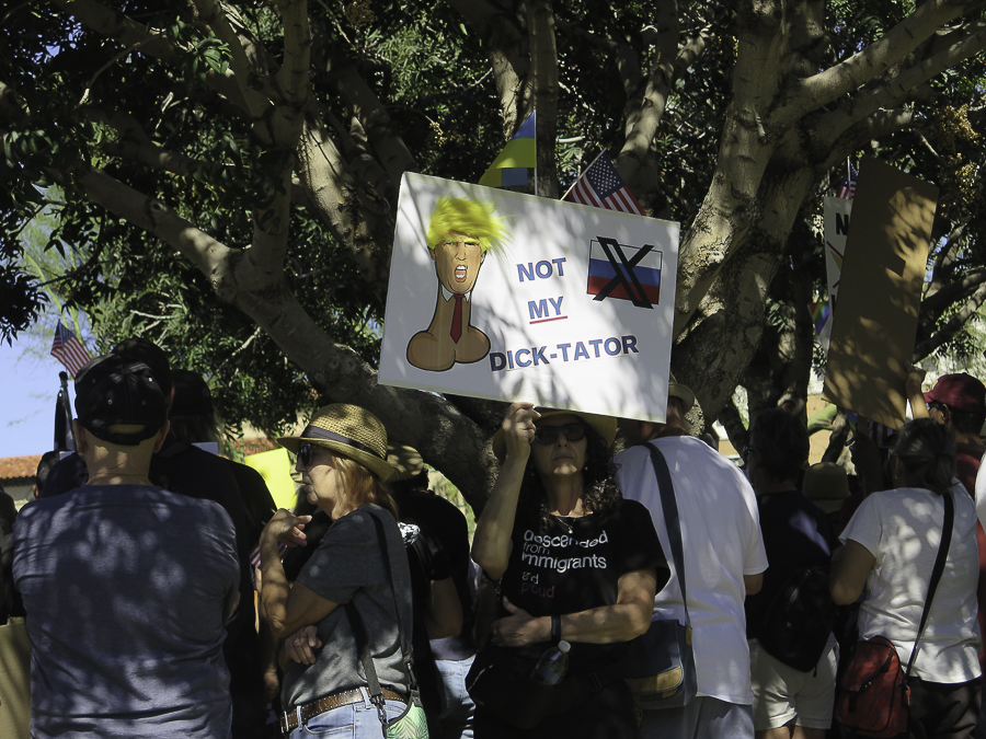 Phoenix No Kings 2.0 rally signs reading Not My Dick-Tator with Trump caricature and Descended from immigrants and proud shirt